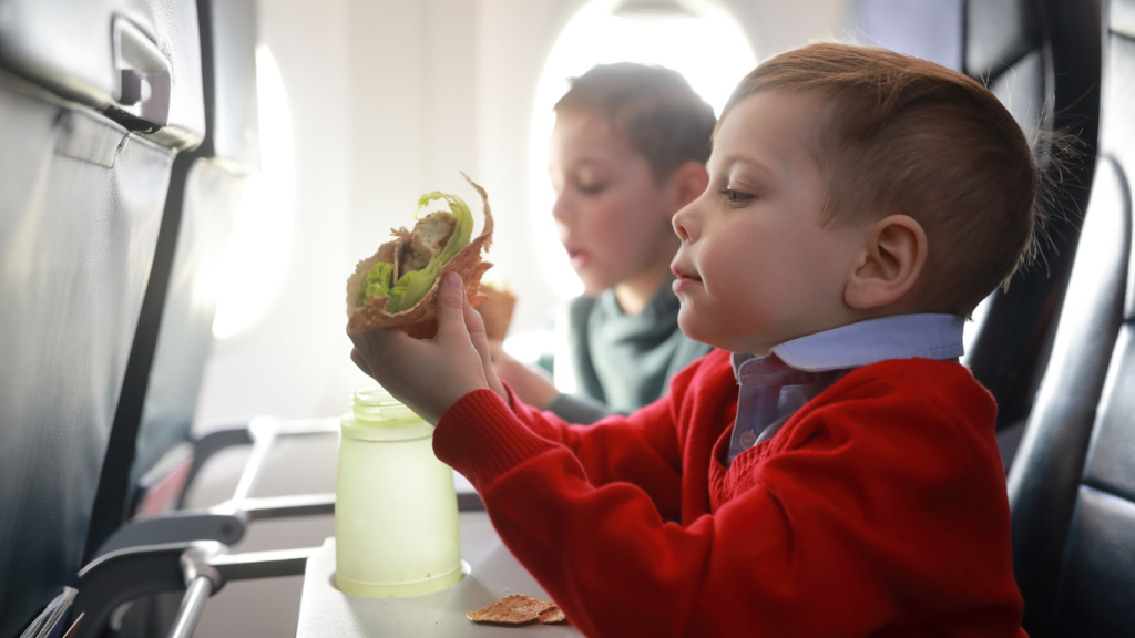 child eating on a flight