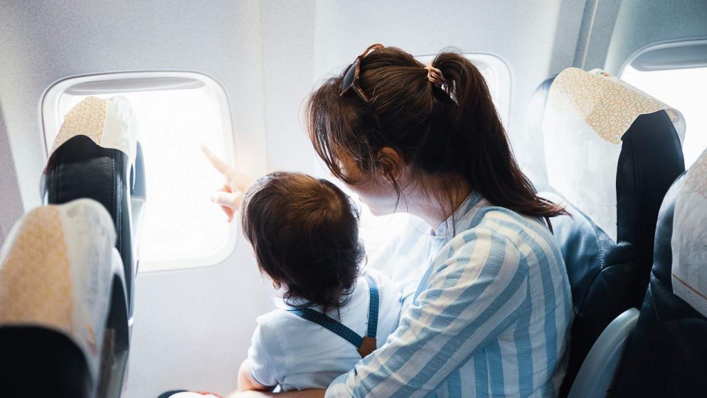 Mother with child on a plane