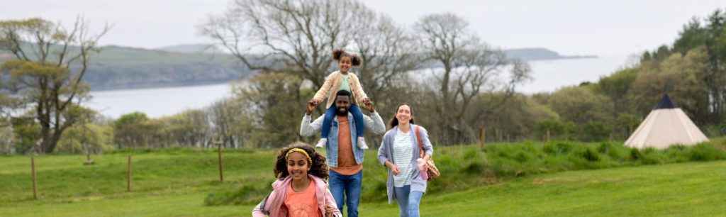 Happy family of four in a park